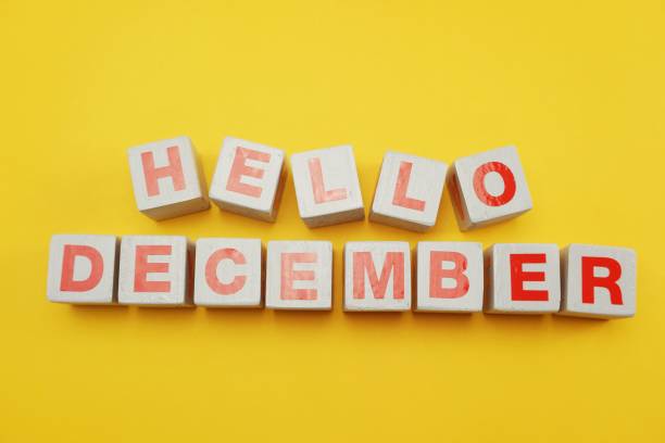 istock hello december alphabet letters on yellow background 1064948670