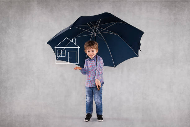 istock young insurance agent under umbrellas, protects your property 1064949026