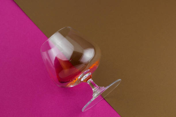 istock wine  on brown and pink  background 1064950288
