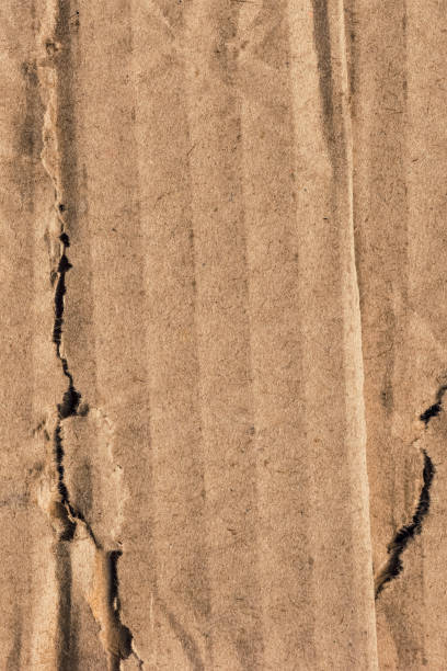 istock Recycle Brown Corrugated Cardboard Torn Crumpled Rough Grunge Texture Sample 1064950518