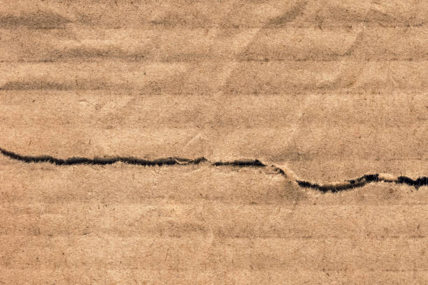 istock Recycle Brown Corrugated Cardboard Torn Crumpled Rough Grunge Texture Sample 1064950560