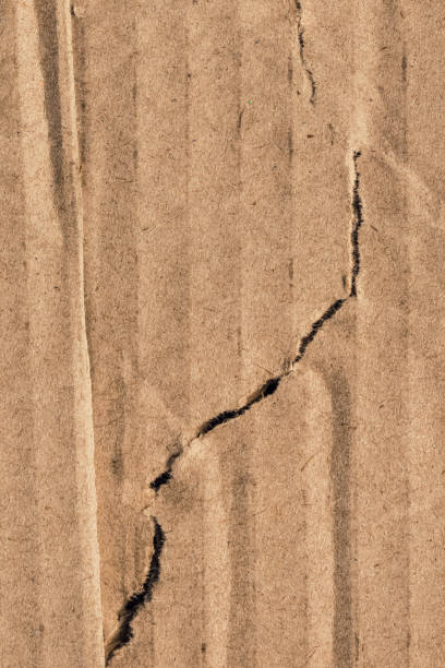 istock Recycle Brown Corrugated Cardboard Torn Crumpled Rough Grunge Texture Sample 1064950676