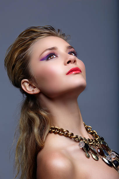 istock blond woman with purple cat eye make-up 106495264