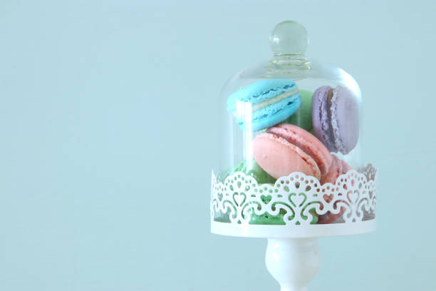 istock Image of colorful macaron or macaroon over pastel blue background. 1064953412