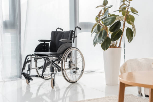 istock empty wheelchair in nursing home 1064954284