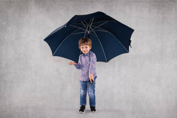 young insurance agent under umbrellas, copy space