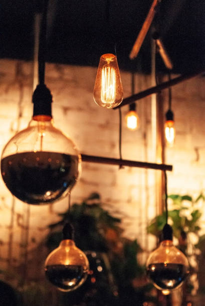 istock Vintage design tungsten light bulb hanging from ceiling 1064964324