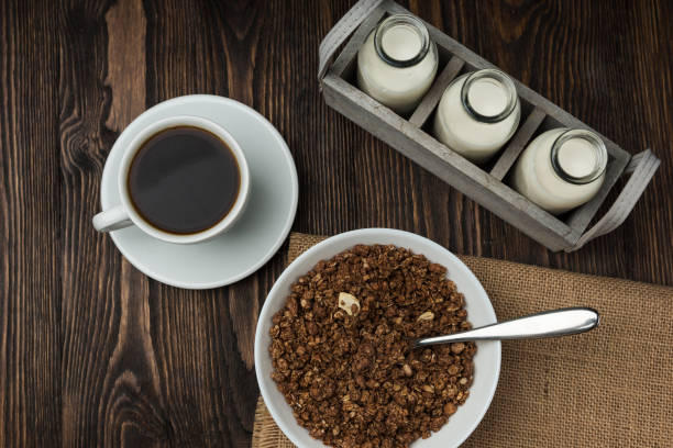 istock Coffee with milk and muesli granula, breakfast time. 1064964696