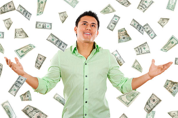 istock Money raining from the sky on a young man 106496472