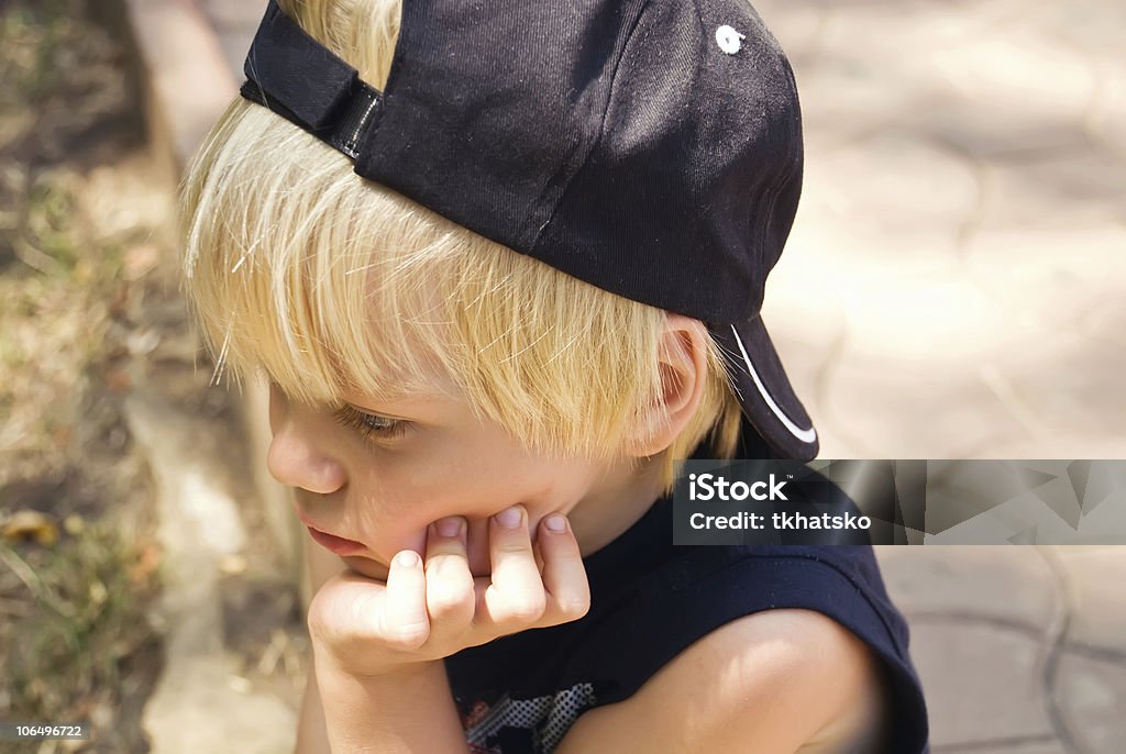 The thoughtful boy The little boy with a thoughtful face Adversity Stock Photo