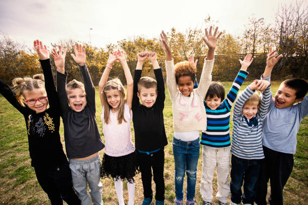 istock Happy kids running on meadow 1064967494