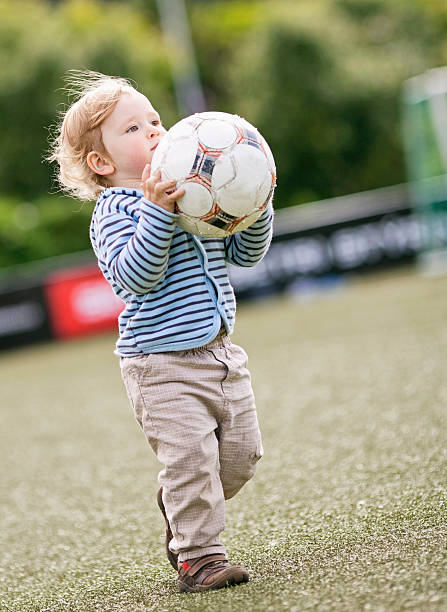 istock Small boy in football field 106496817