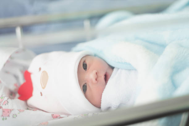 istock Portrait of cute baby on the bed 1064970708
