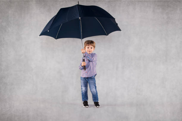 istock young insurance agent under umbrellas, an empty place for you 1064973090