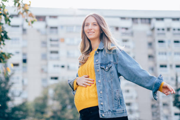 istock Pregnant woman in park 1064973254