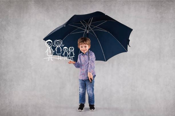 istock young insurance agent under umbrellas, protects your family 1064973478