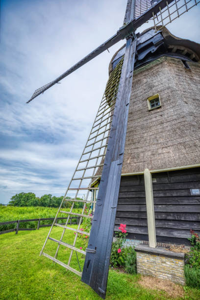 istock Dutch landscape with the vintage windmill (HDRi) 1064975400