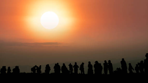 istock Group of people  silhouette in mountains 1064975608