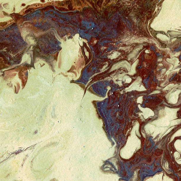 istock Very beautiful textural background. Light beige-sand paint flows in dark brown with the addition of dark blue paint. The style includes curls of marble or pulsations of agate with bubbles and cells. 1064977384