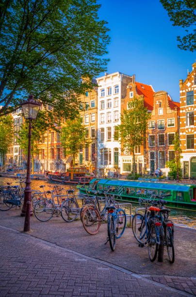 istock bikes and canals of Amsterdam (HDRi) 1064980914