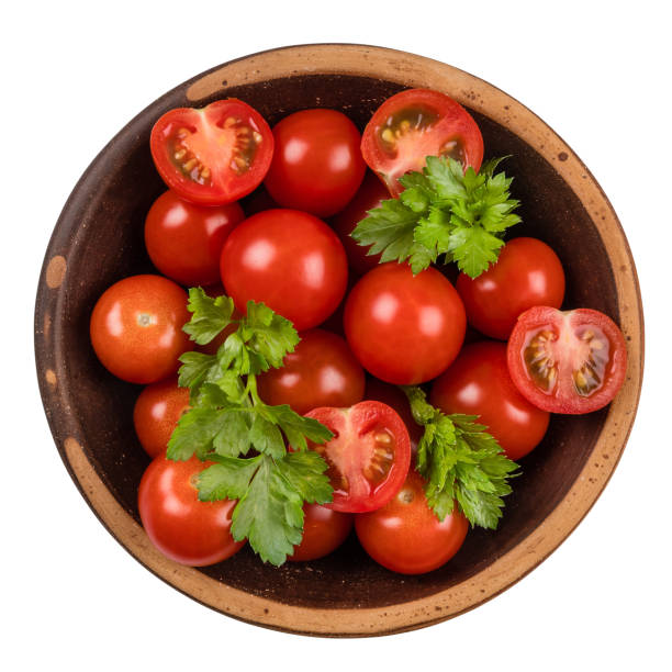 istock Fresh tomatoes on plate. Isolated on white background. Top view. 1064980998