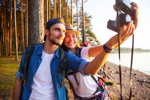 istock Young happy hikers taking a selfie in the nature. 1064984488