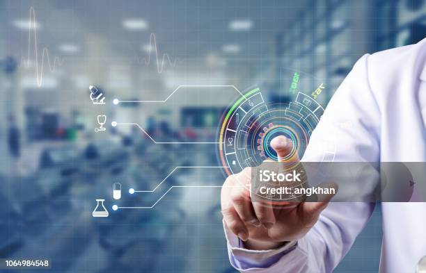 Doctor Scan Index Finger And Log In For Medical Data Base Of Patient Stock Photo - Download Image Now