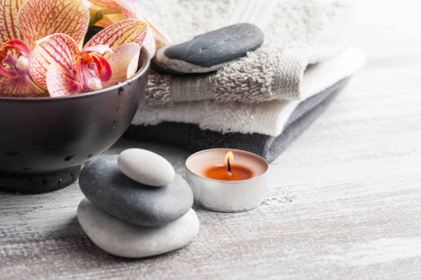 istock Spa still life with pebbles and red orange orchid 1064984948