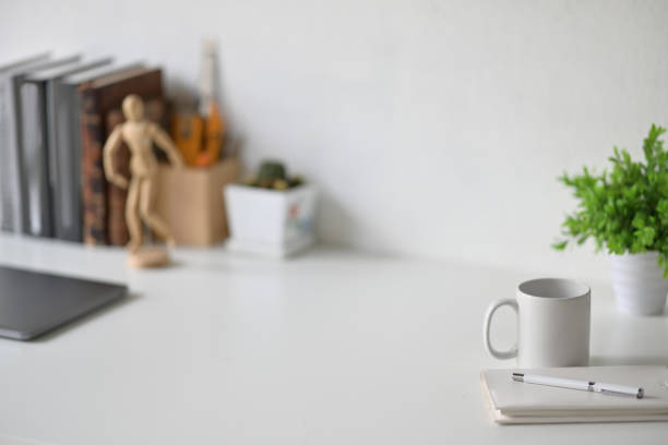 istock Loft workplace, copy space, laptop and supplies. 1064988312