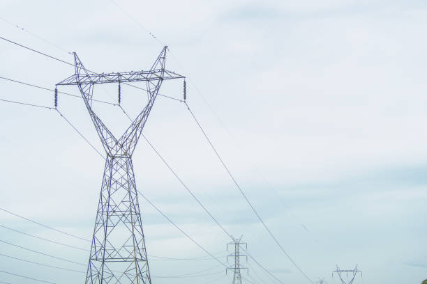 istock Power poles lined up in the sky without the sun. 1064988730