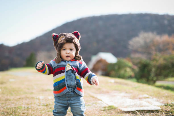 istock Baby playing in the park 1064990584