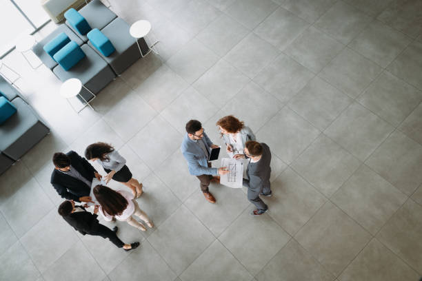 istock Group of business people collaborating and working on project 1064990752