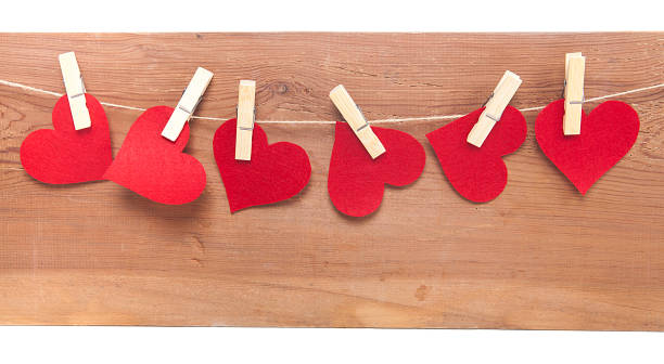 Tiny red heart sign isolated on wooden background. Red heart sign isolated on wooden background. Heart broken, love and valentines day concept. pulse orlando night club & ultra lounge stock pictures, royalty-free photos & images