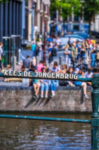 istock tourists in Amsterdam (HDRi) 1064992446