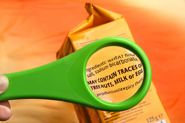 Magnifying glass on food ingredients and additives label.