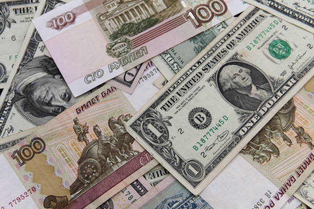 istock Background of the us dollars and russian rubles banknotes 1064997790