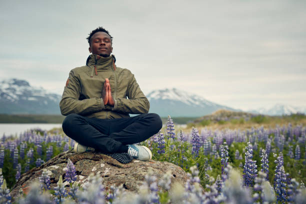 istock Meditating on a meadow full of blooming lupines 1065000052