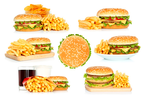 Set of hamburgers, French fries and chips with cola on white background