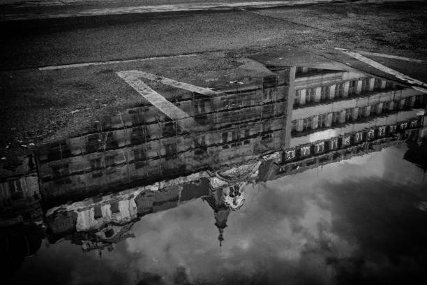 istock Reflection of building in a puddle in Prague 1065002762