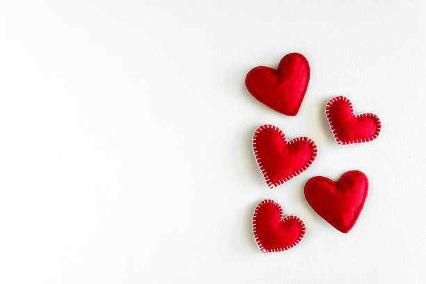 Present box with felt love hearts on white wooden background. Valentine's day celebration concept. Top view. Flat lay. Copy space Present box with felt love hearts on white wooden background. Valentine's day celebration concept. Top view. Flat lay. Copy space felt heart shape small red stock pictures, royalty-free photos & images