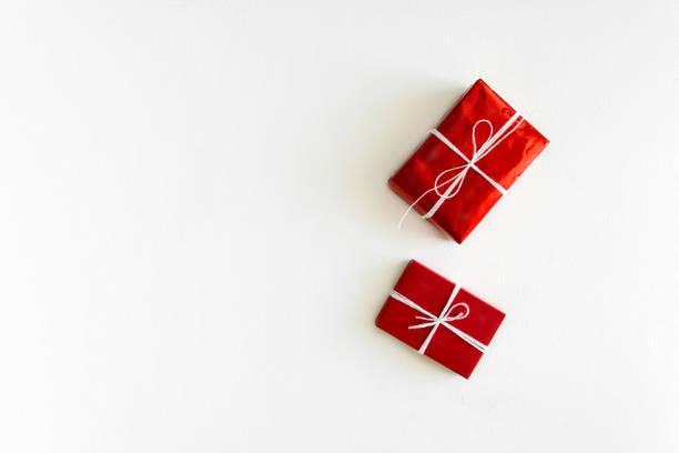 Present box with felt love hearts on white wooden background. Valentine's day celebration concept. Top view. Flat lay. Copy space Present box with felt love hearts on white wooden background. Valentine's day celebration concept. Top view. Flat lay. Copy space felt heart shape small red stock pictures, royalty-free photos & images