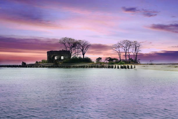 istock castle ruins on small island in cloudy blue sky 1065010112