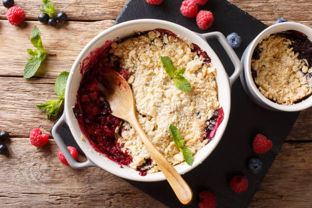 istock English cuisine: berry crumble is decorated with mint closeup.  horizontal top view 1065012756