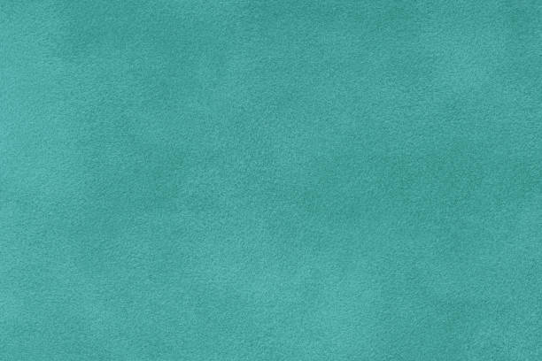 istock turquoise matt suede fabric closeup. Velvet texture. 1065014158