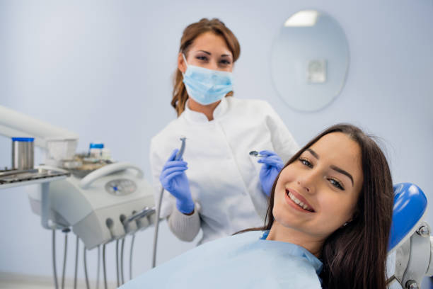 Happy girl smiling at the dentist stock photo