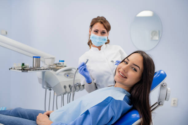 Happy girl smiling at the dentist stock photo