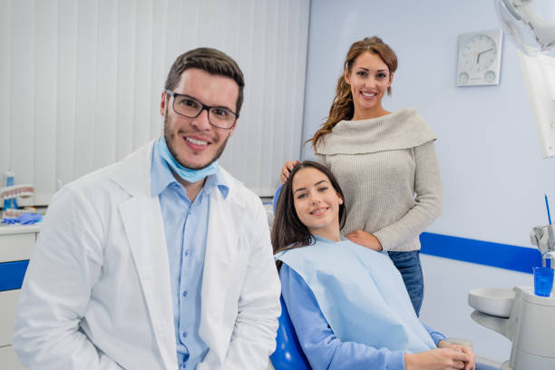 Mother and daughter at the dentist office. stock photo