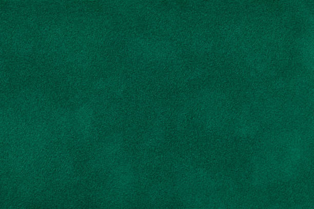 istock Dark green matt suede fabric closeup. Velvet texture. 1065017746