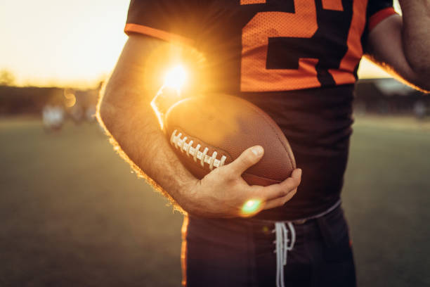 istock American football player with ball 1065018436