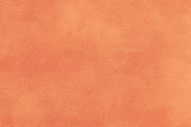 istock Coral matt suede fabric closeup. Velvet texture. 1065024780